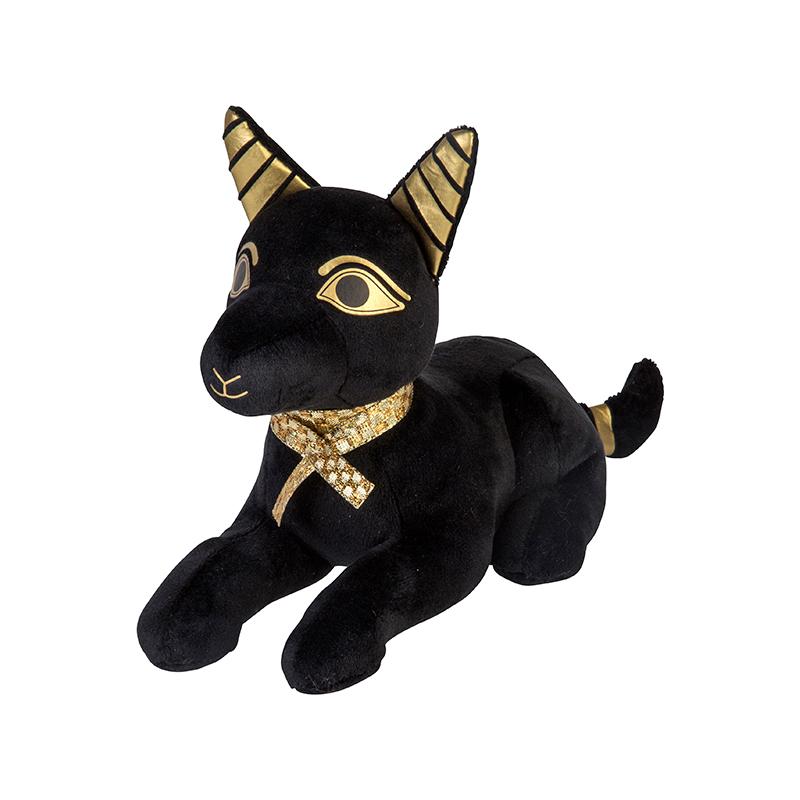 A plush doll representing the Egyptian Anubis with black body and gold accents on the ears, eyes, and collar.