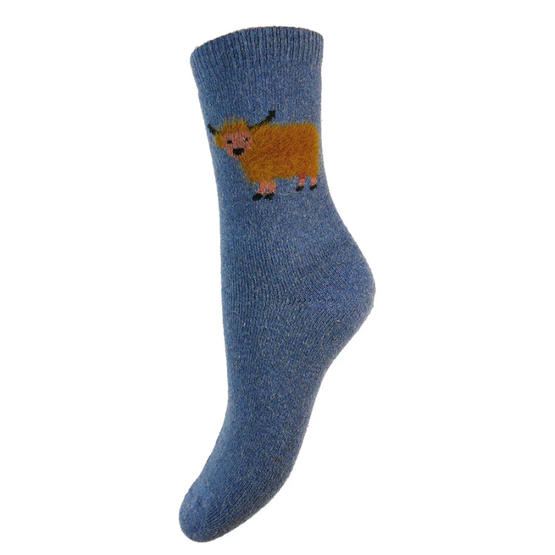 A light blue wool blend sock with a fluffy cow design on the heel area.