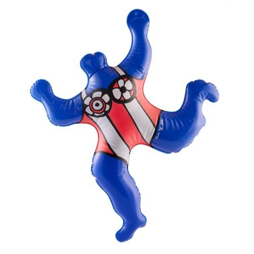 Inflatable sculpture of a stylized figure with a blue body and red and white geometric patterns, resembling Niki de Saint Phalle's 'Nana' sculpture.