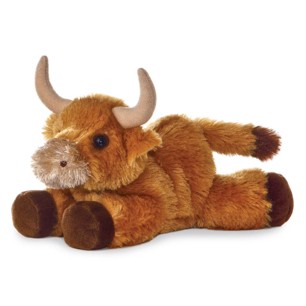 Plush toy bull on a white background