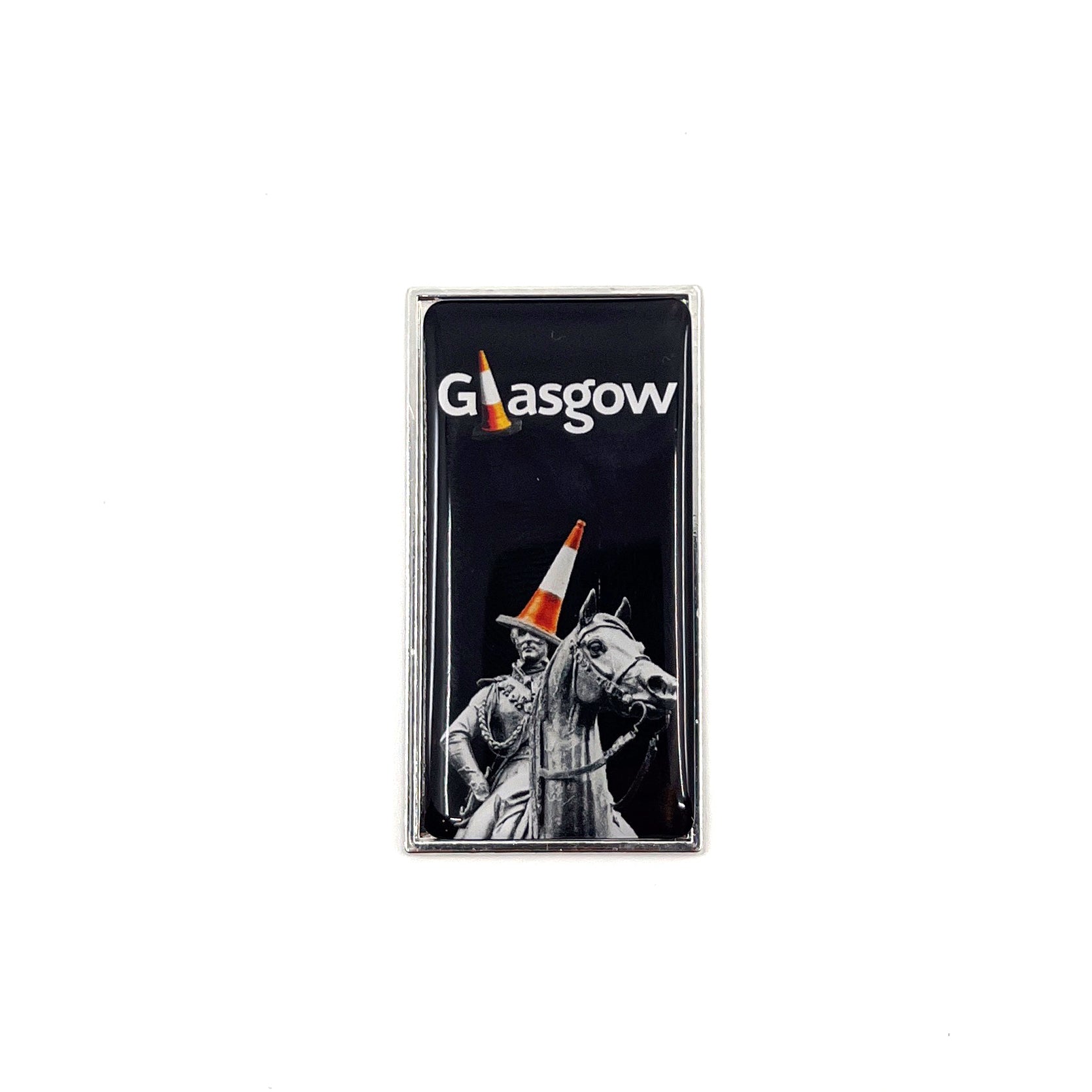 A rectangular fridge magnet featuring the Duke of Wellington statue in Glasgow, adorned with a traffic cone, against a black background.