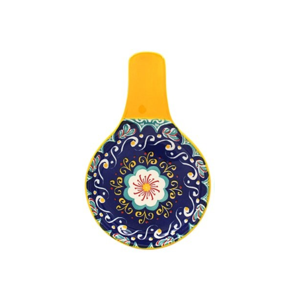 Decorative spoon rest with floral design on a white background